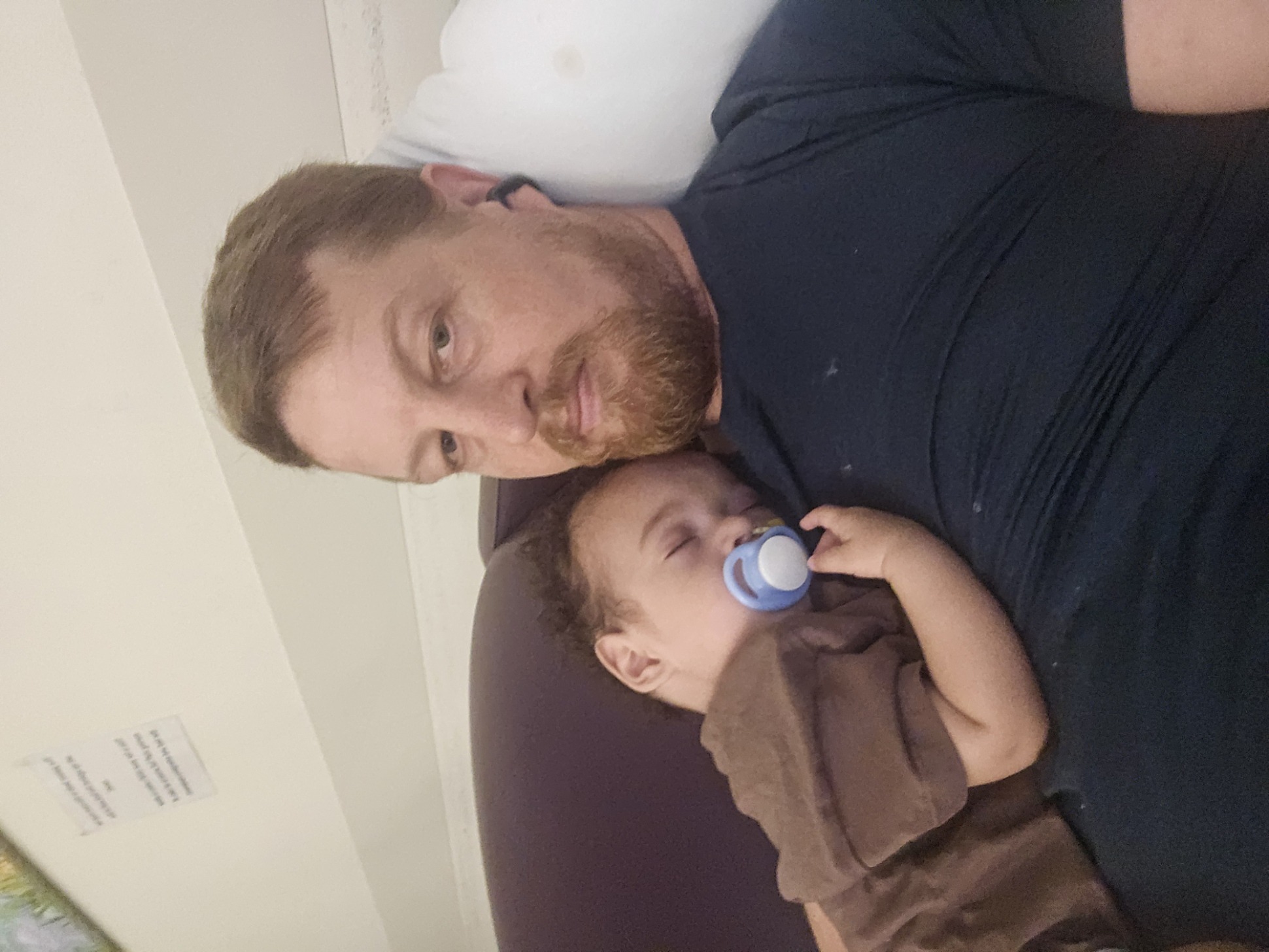 Asleep on Dad's chest with his dummy. Pure peace.